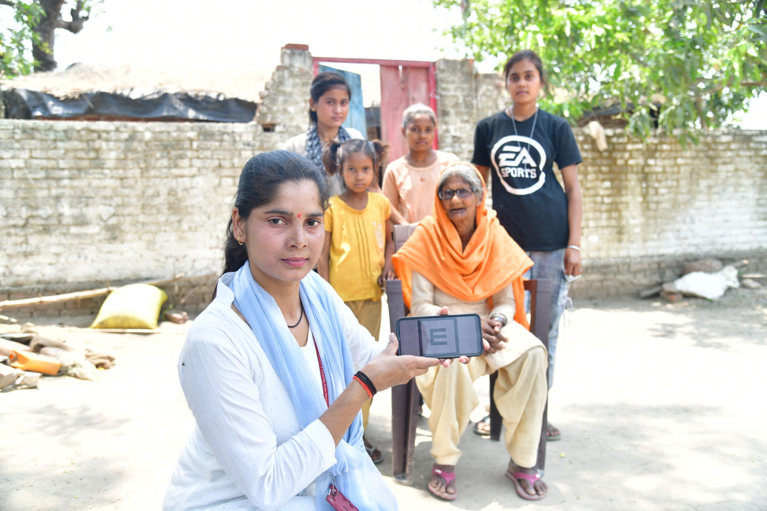 A vision technician tests a patient's sight at a Vision Centre